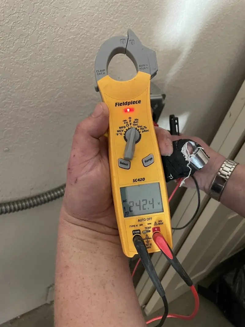 Voltage testing with clamp meter during Ceiling Fan Installation in Netcong